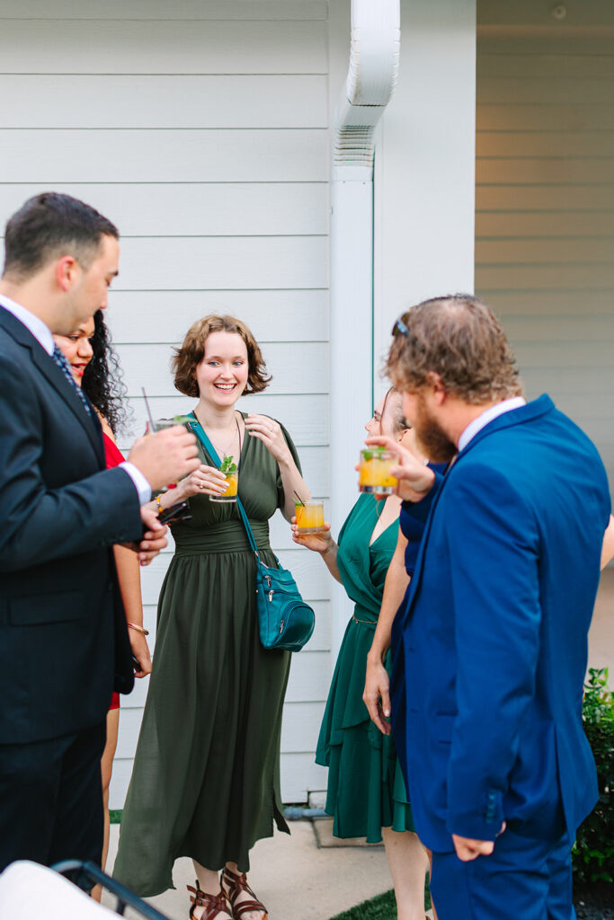 wedding guests mingling during cocktail hour