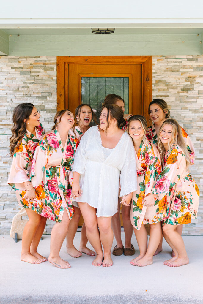 Bride and bridesmaids in colorful summer wedding robes