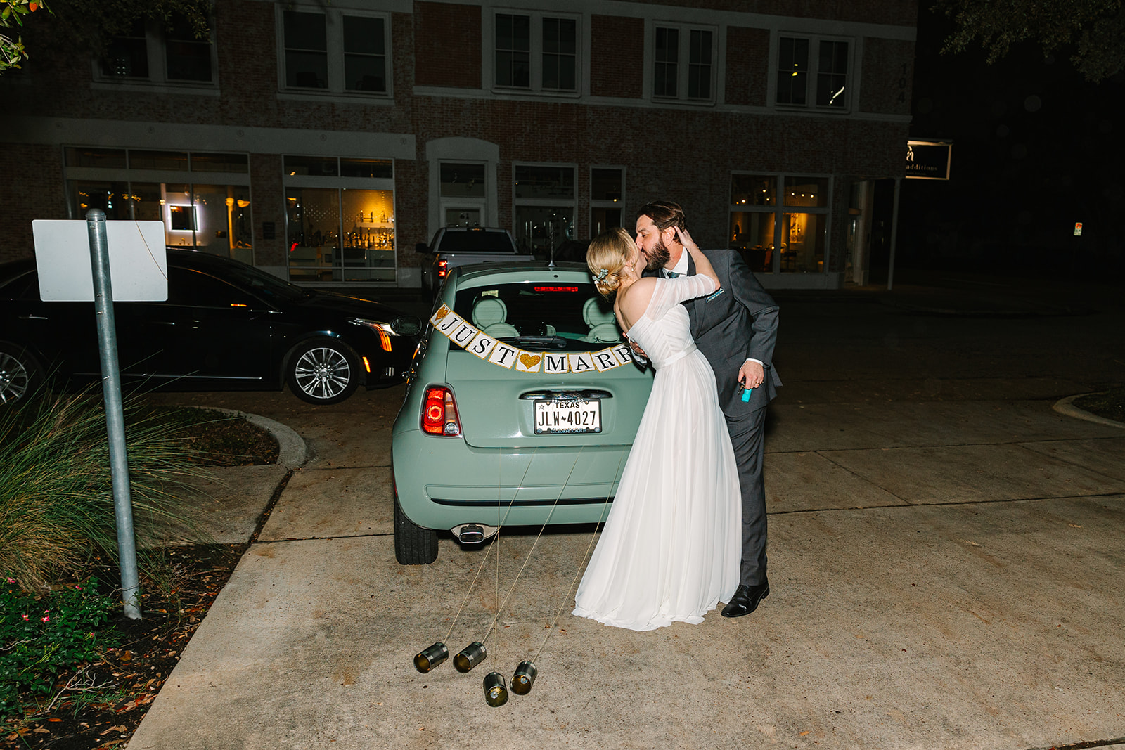 Bride and grooms just married car