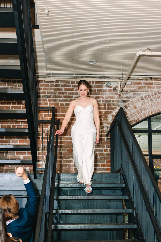Bride walking into reception after outfit change