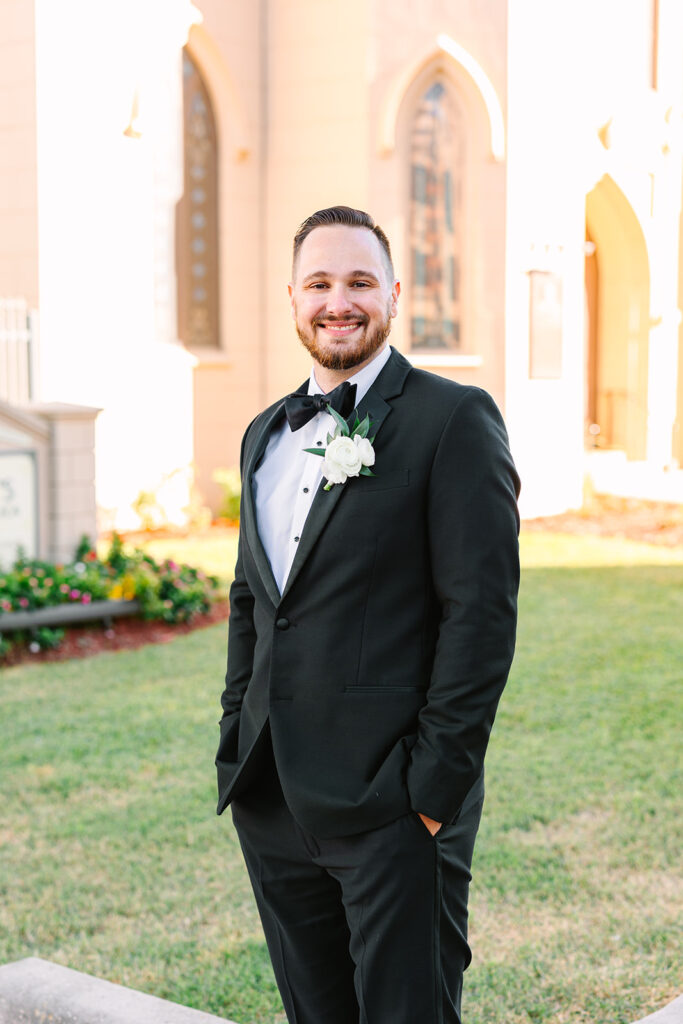 Groom portraits from an elevated winter wedding in Galveston