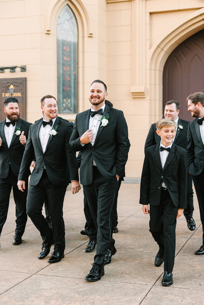 Groom and groomsmen photos from a wedding in Galveston, Texas