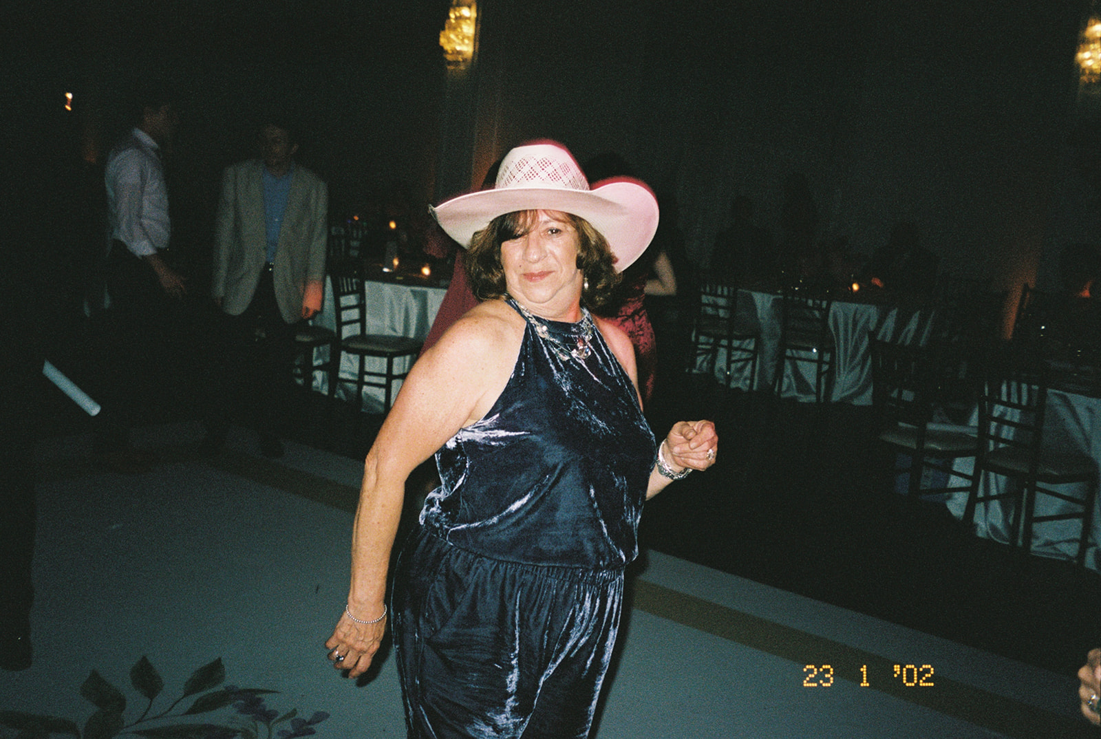 a group of people dancing on a dancefloor for a wedding