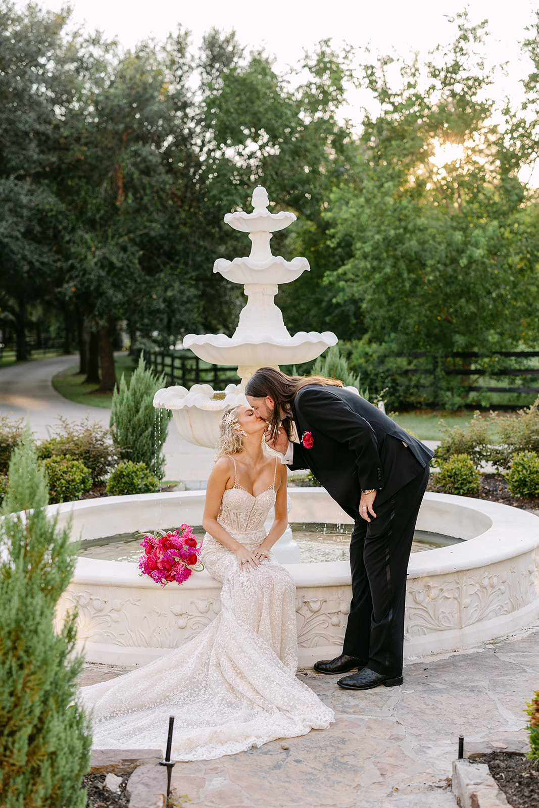 bride and groom take wedding portraits at sandlewood manor houston