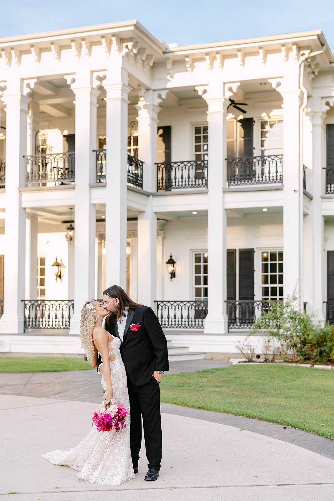 bride and groom take wedding portraits at sandlewood manor houston