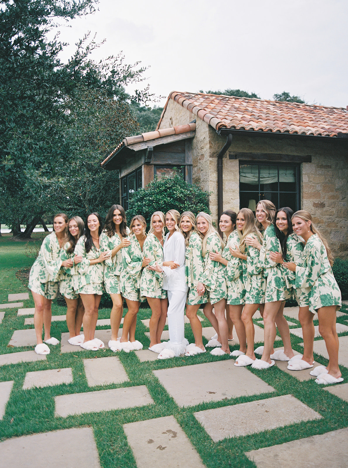 bride getting ready for her wedding with her bridesmaids