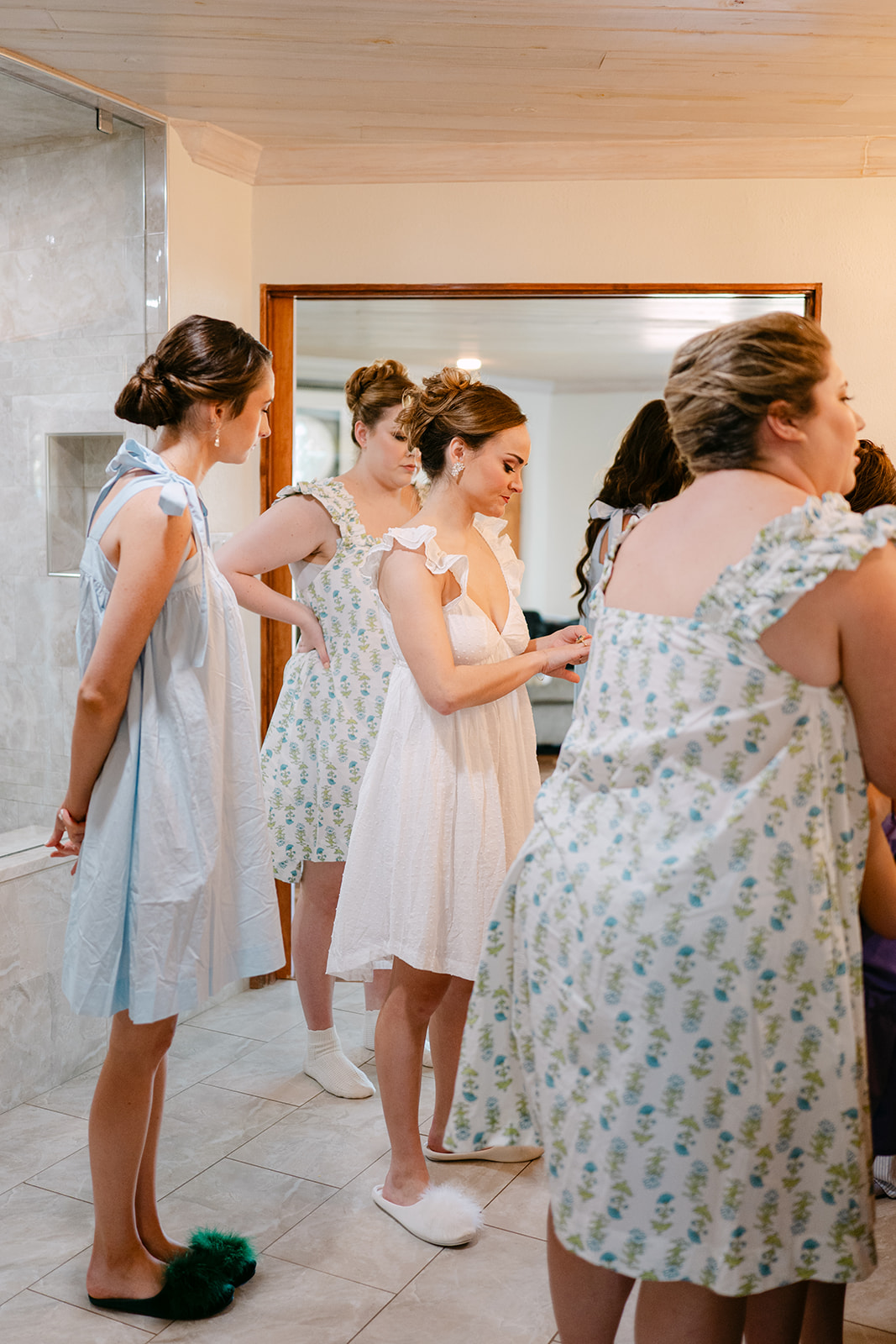 bride getting ready with her bridesmaid on her wedding day at La Bonne Vie Ranch
