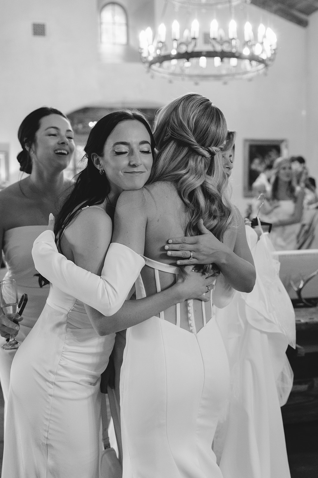bride getting ready for her wedding with her bridesmaids