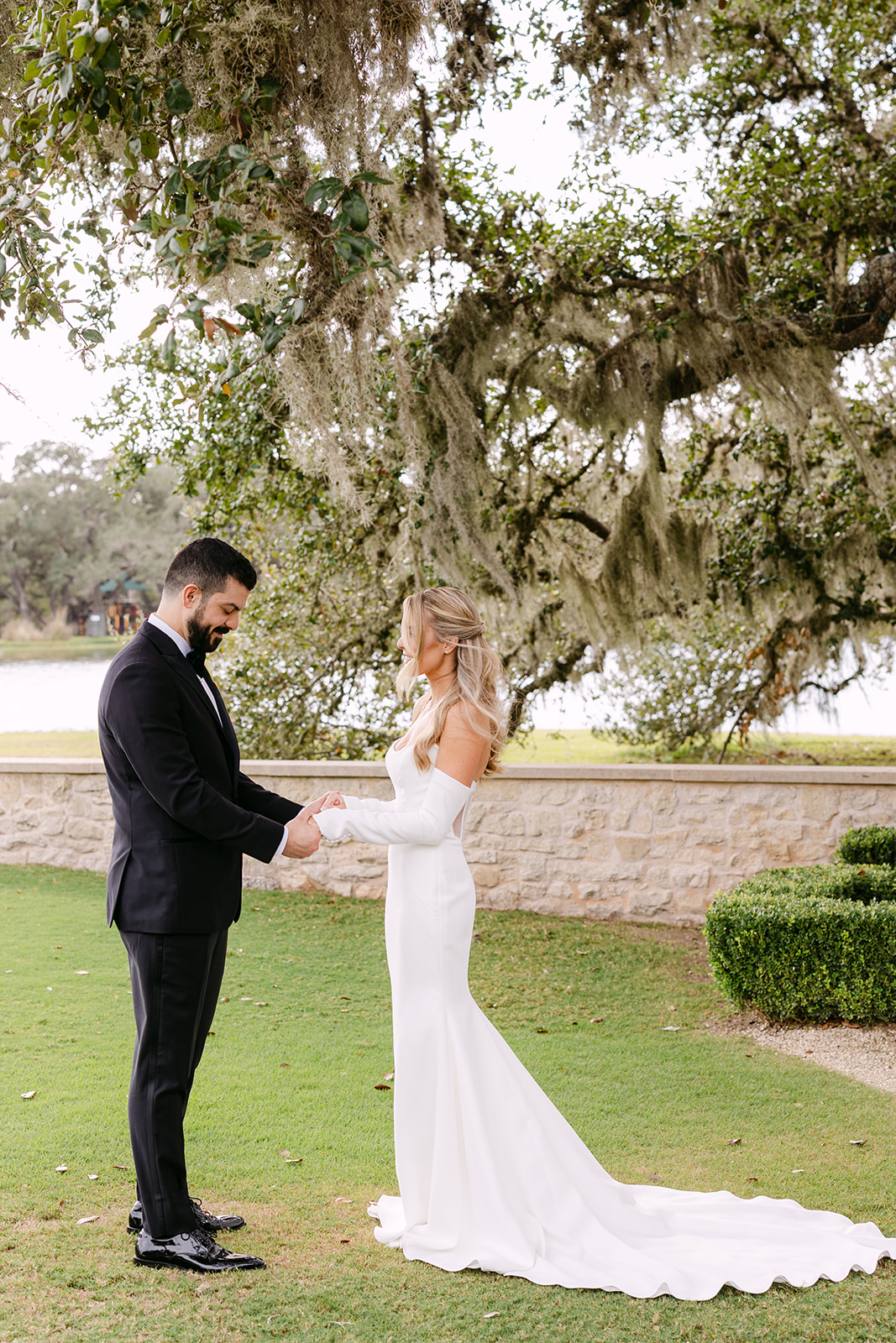 Bride and groom take wedding portraits at their wedding at The Houston Oaks Country Club