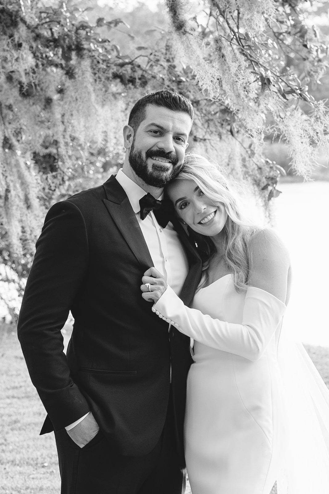 Bride and groom take wedding portraits at their wedding at The Houston Oaks Country Club