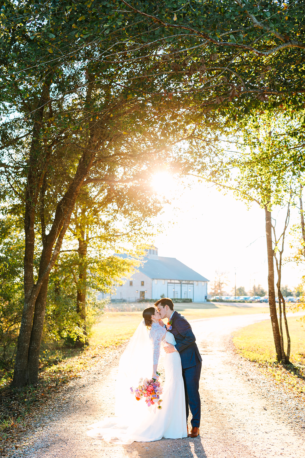 bride and groom take wedding portraits on their wedding day at Beckendorff Farms in Katy, TX