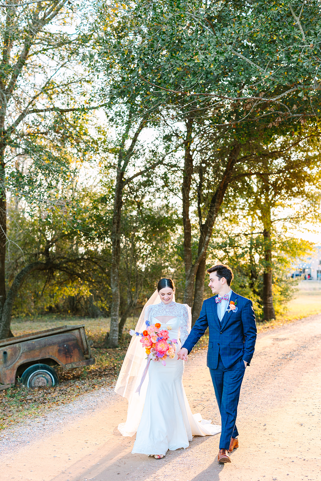 bride and groom take wedding portraits on their wedding day at Beckendorff Farms in Katy, TX