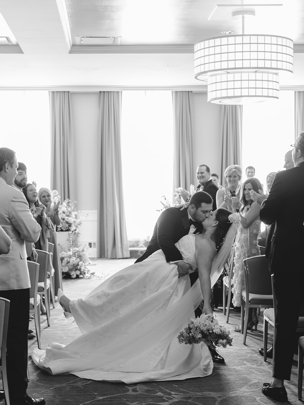 A wedding ceremony indoors with guests nearby at the tremont house
