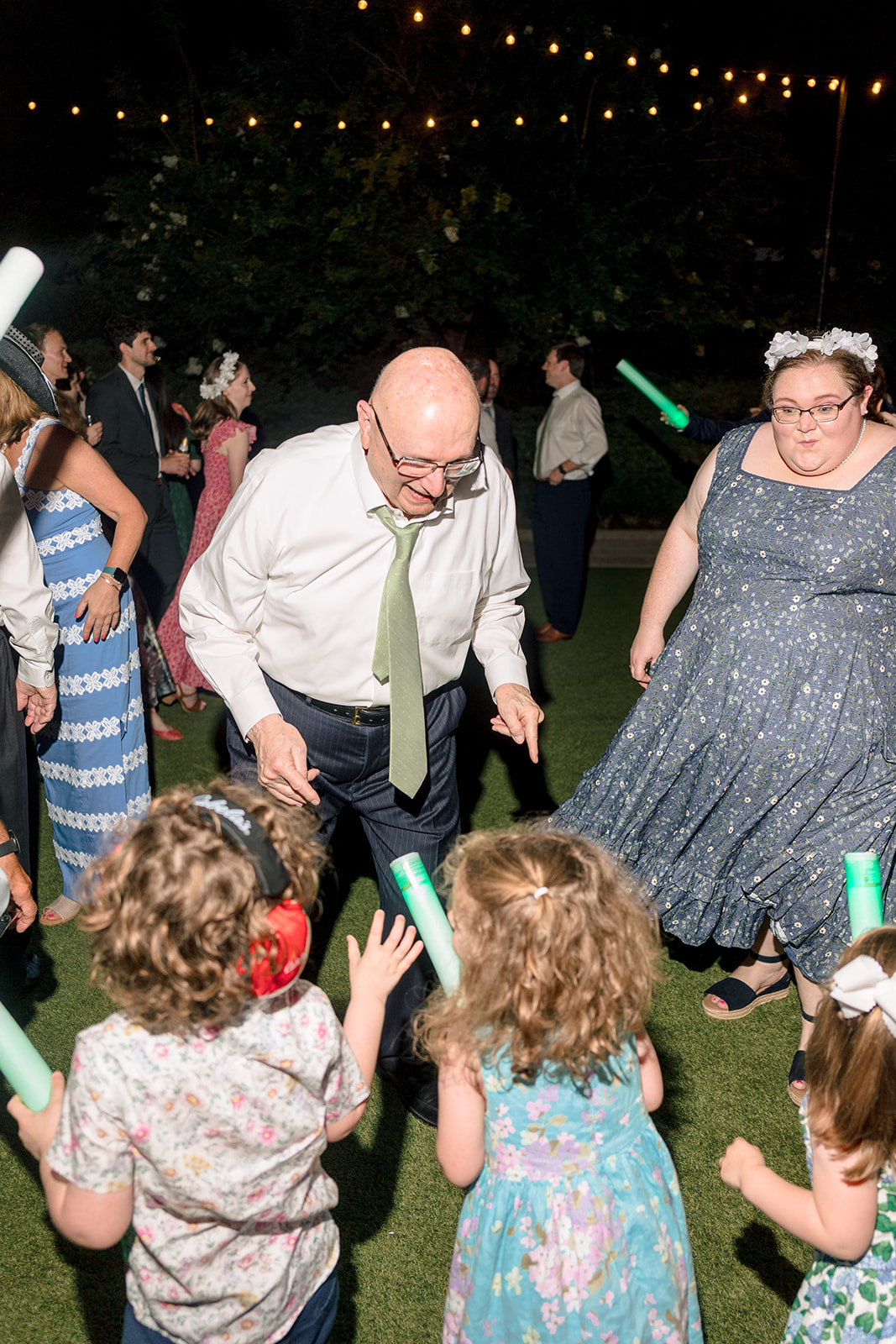 People dance together at a lively indoor event. 