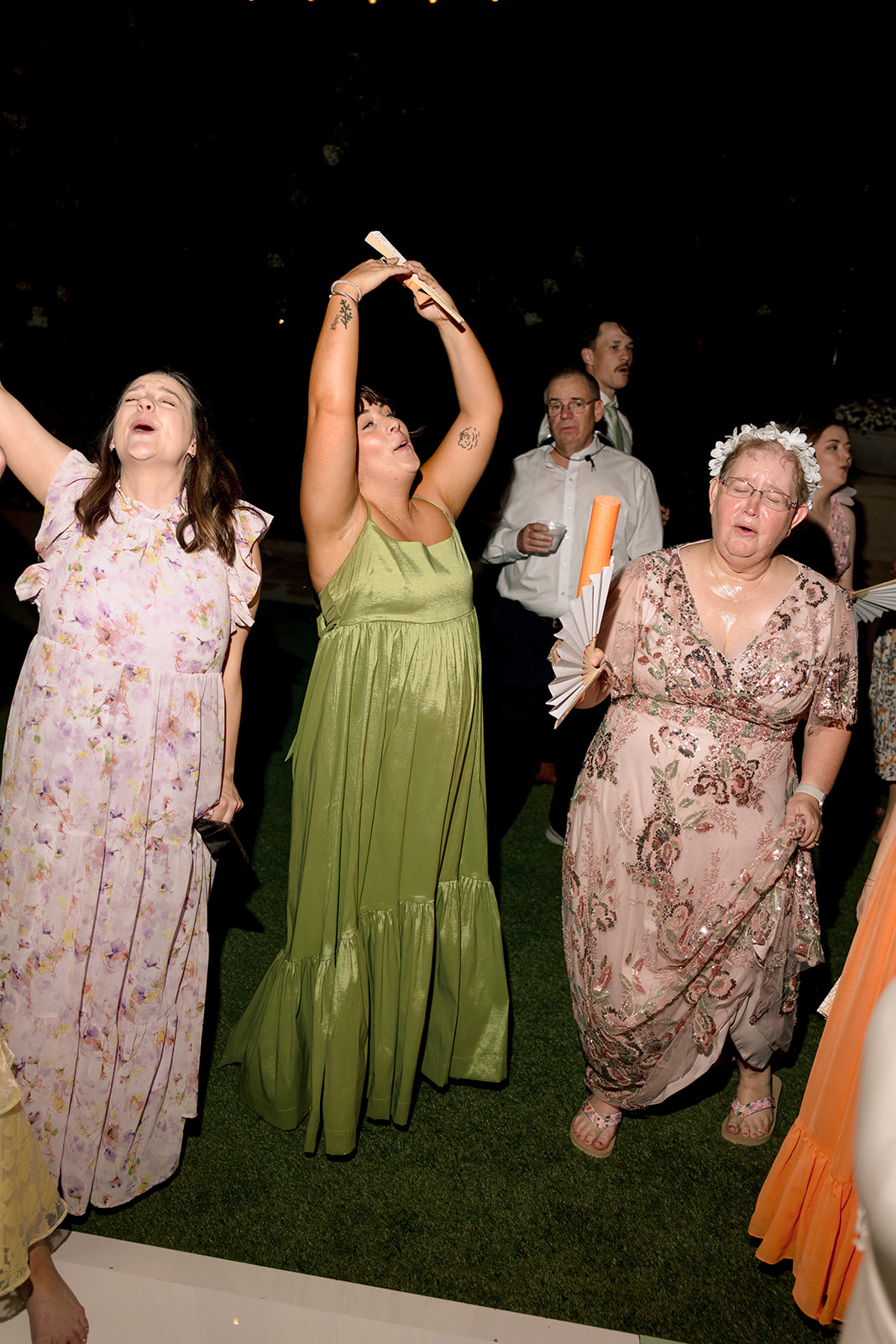 People dance together at a lively indoor event. 