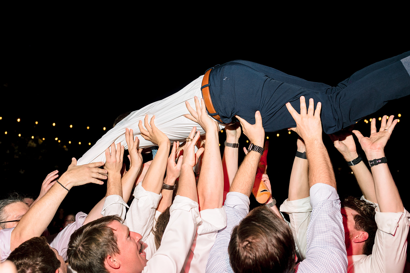 People dance together at a lively indoor event. 