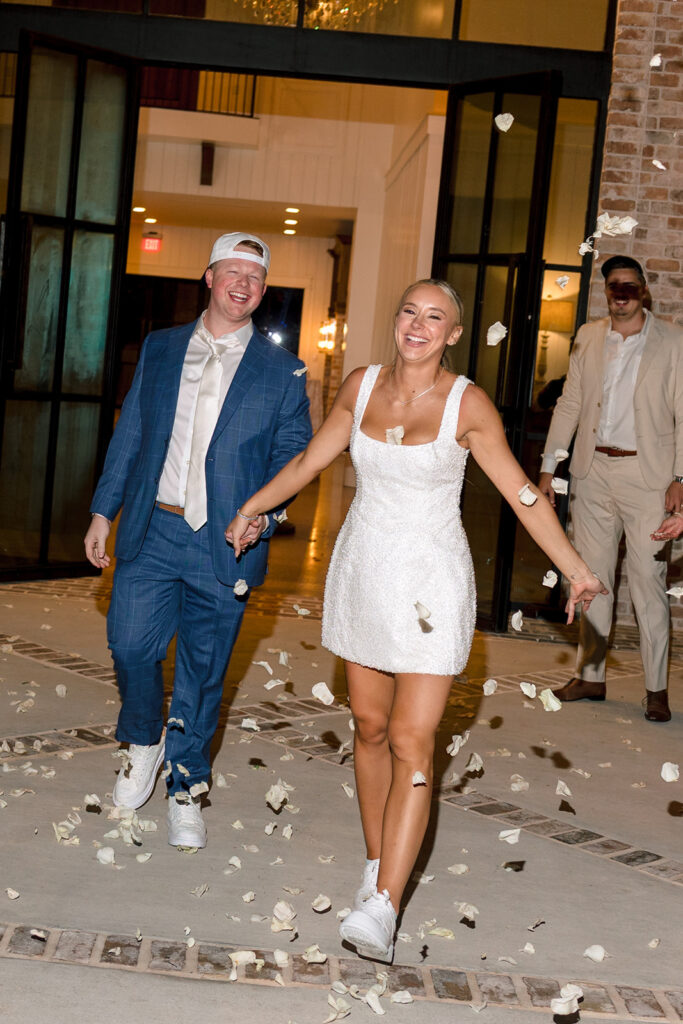 a group of people dance on the dance floor for a wedding celebration