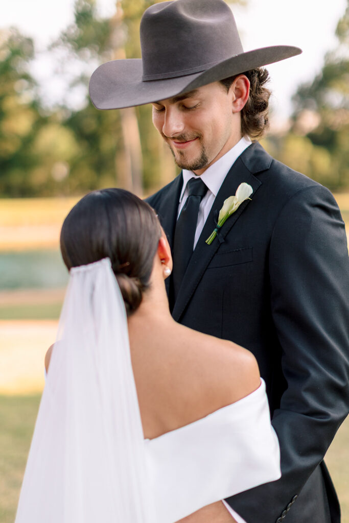 cute picture of the bride and groom smiling at each other