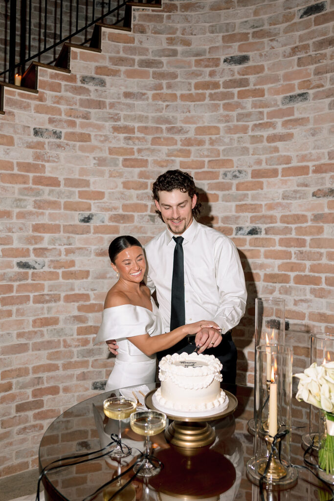newlyweds cutting their wedding cake