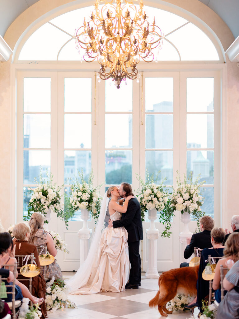 bride and groom kissing after their ceremony