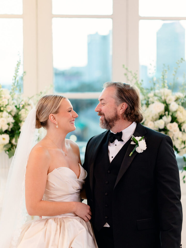 cute picture of the newlyweds smiling at each other