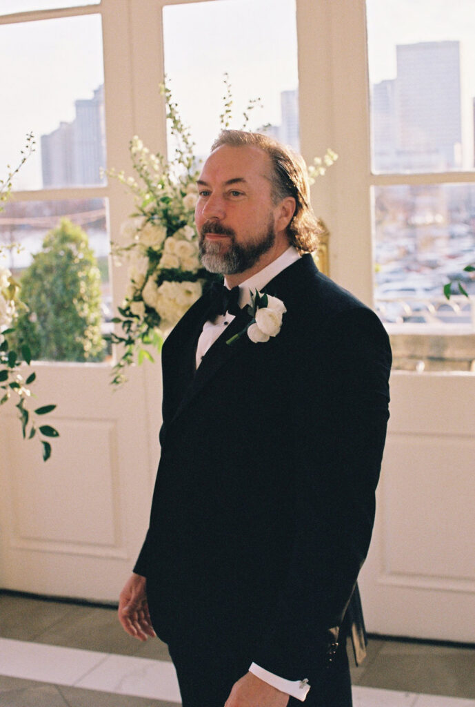 groom emotional watching the bride walk down the aisle