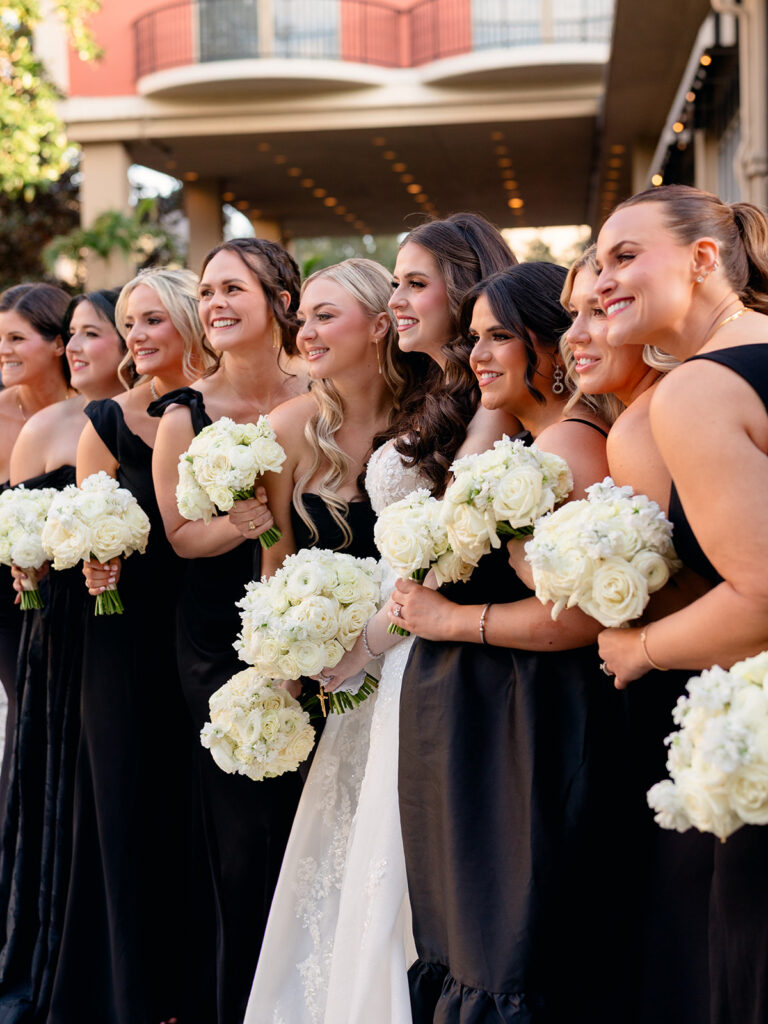 cute picture of the bride and groom with her bridesmaids