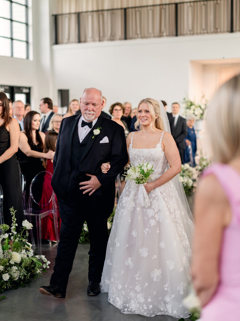 cute picture of the bride walking down the aisle