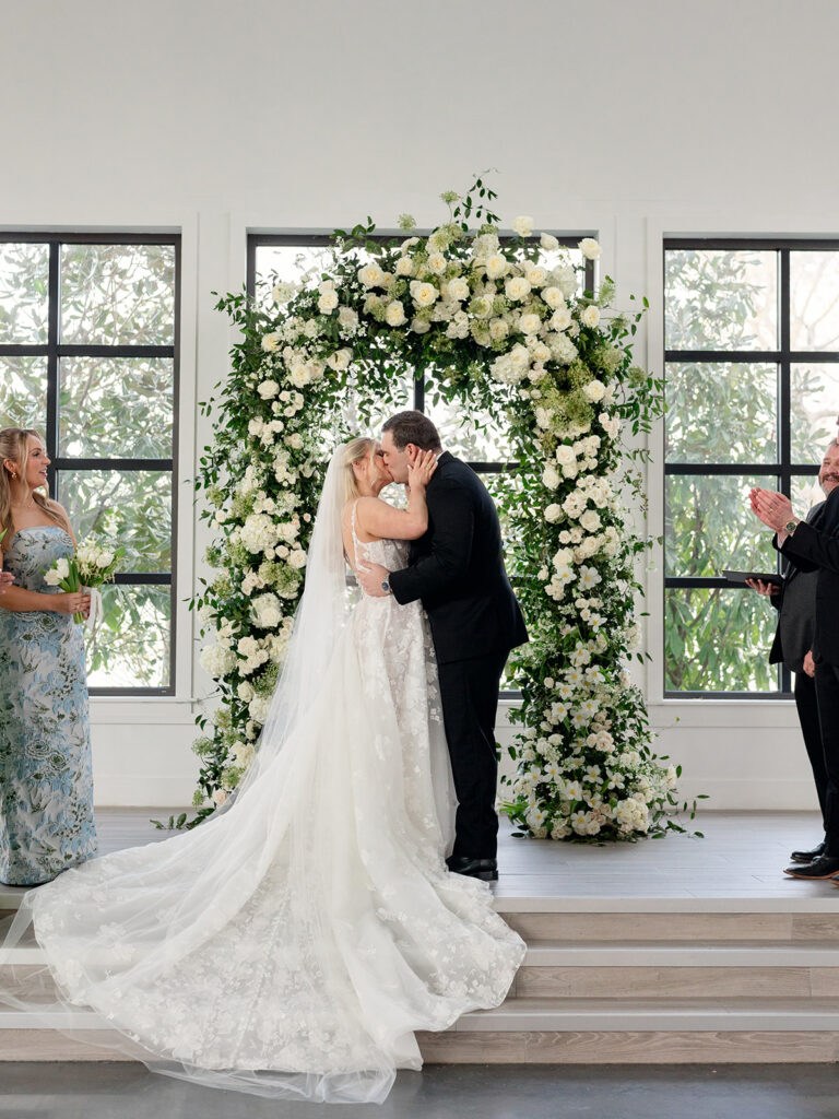 cute picture of the newlyweds kissing after their ceremony