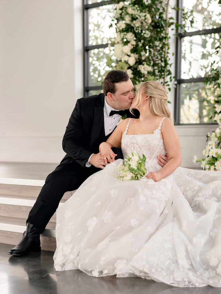cute portrait of the newlyweds kissing