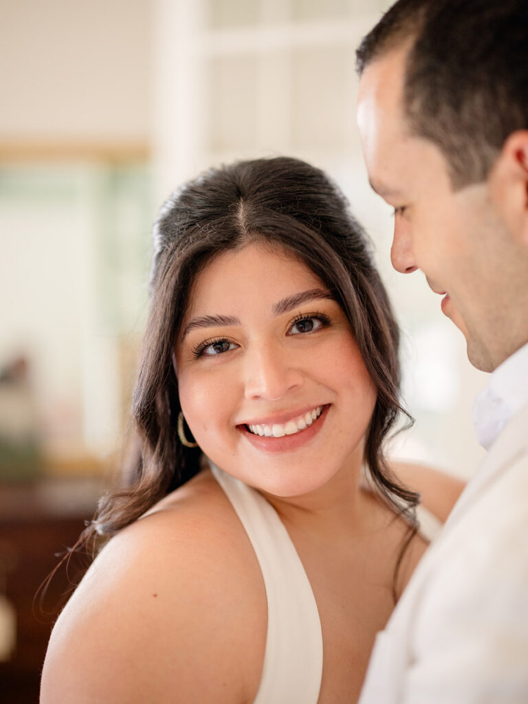 couple smiling at the camera during their photoshoot