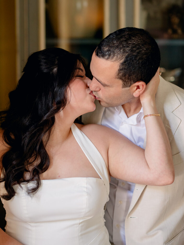 beautiful picture of the newly engaged couple kissing