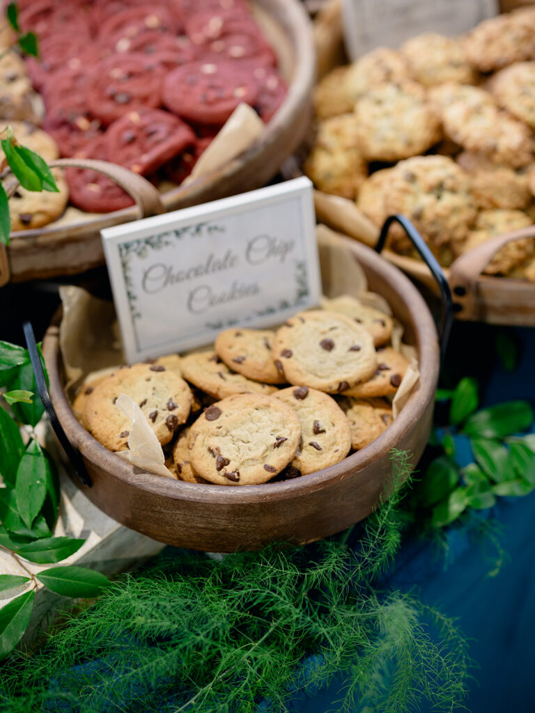 Chocolate chip cookies in a wooden basket on the cookie bar