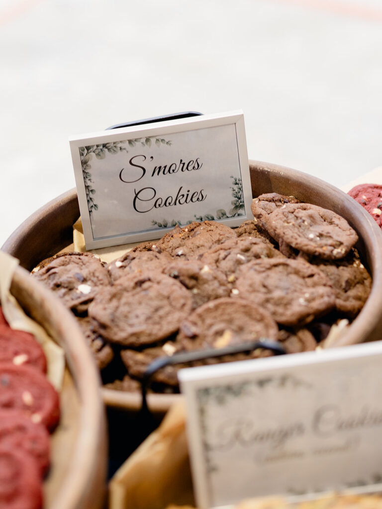 Smores cookies in a basket with a calligraphy label at the rehearsal dinner