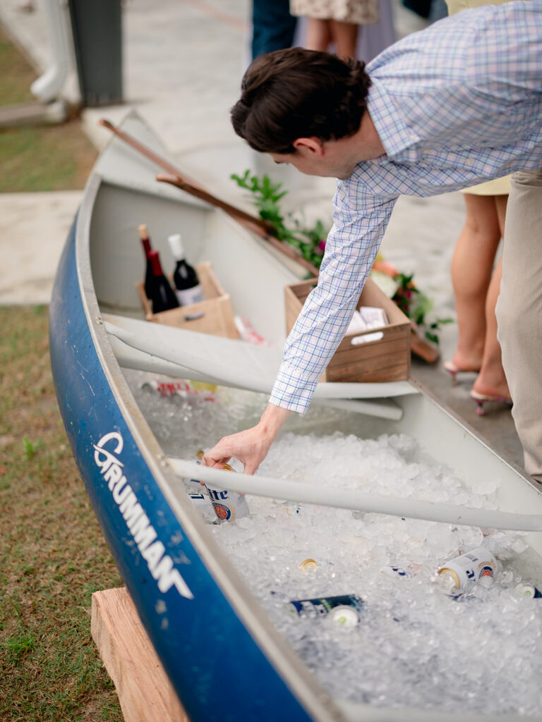Guest reaching into the canoe drink station