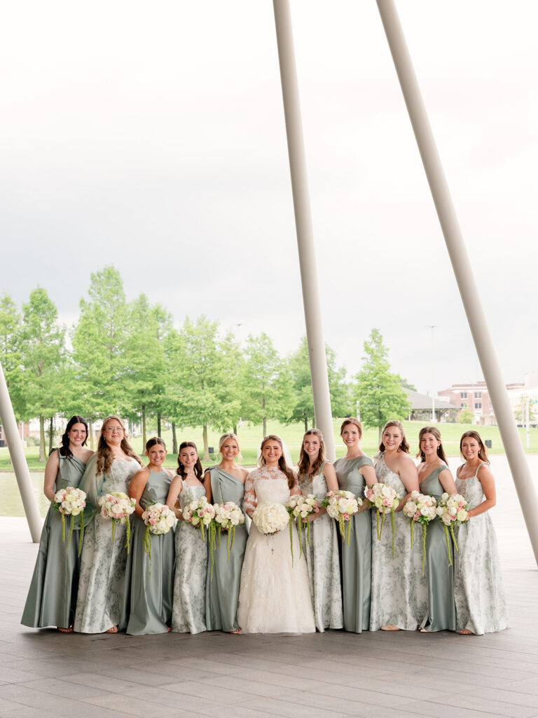 Wide photo of the bride with her bridesmaids