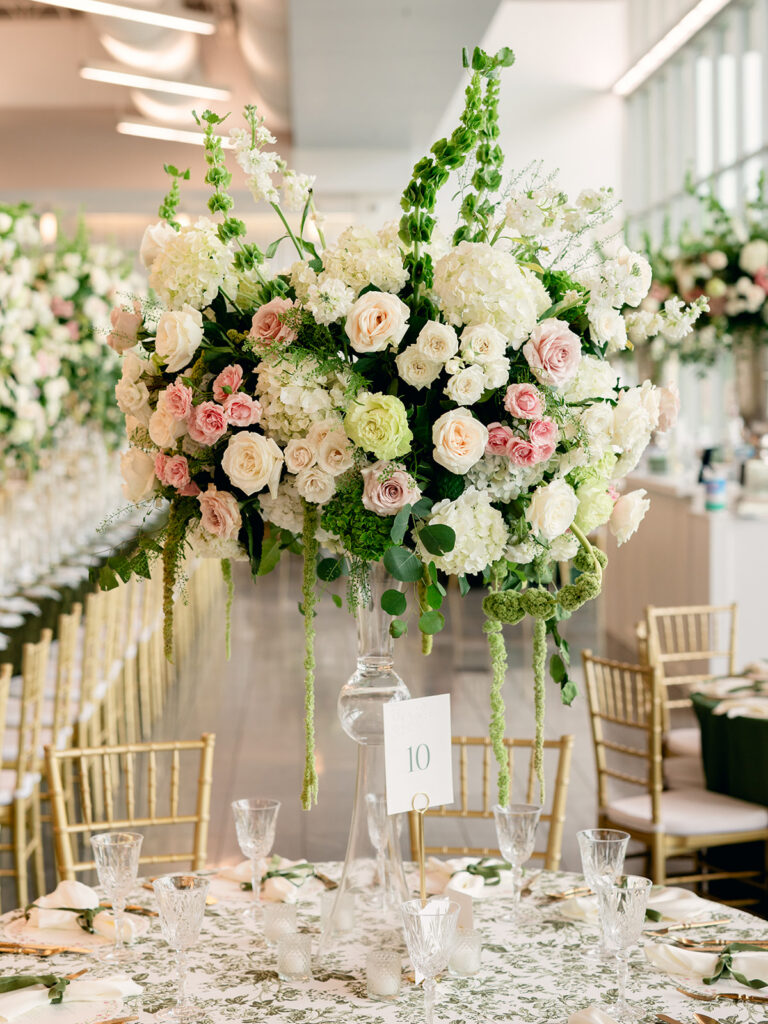 Tall white and blush floral centerpiece at the reception