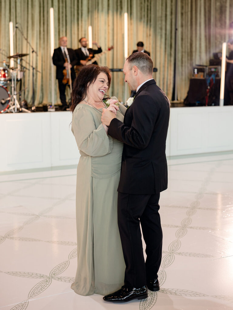 Groom dancing with his mother at the reception