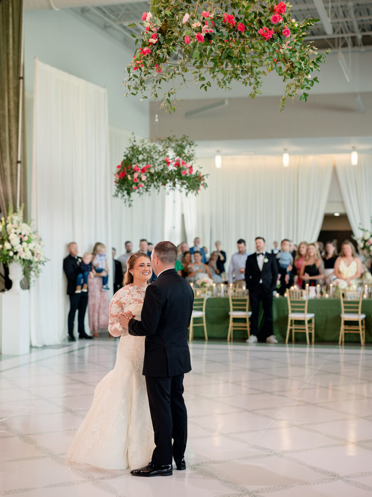 First dance under hanging floral installations