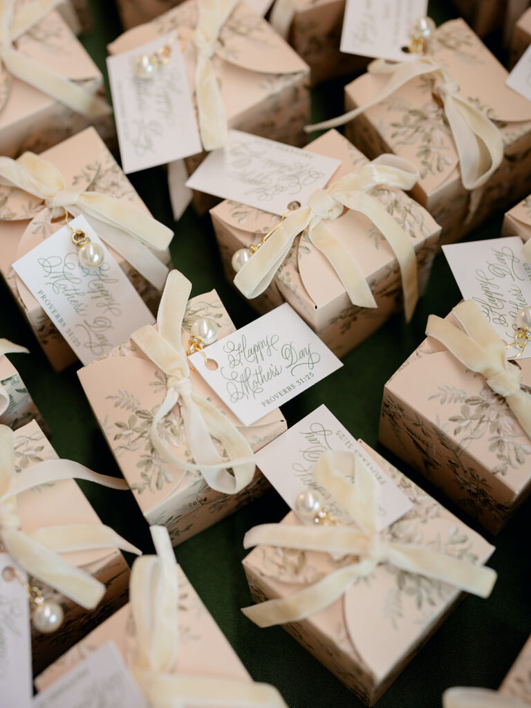 Wedding favor boxes tied with ivory ribbon