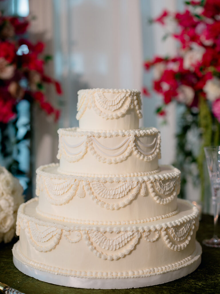 Close up of the white tiered wedding cake