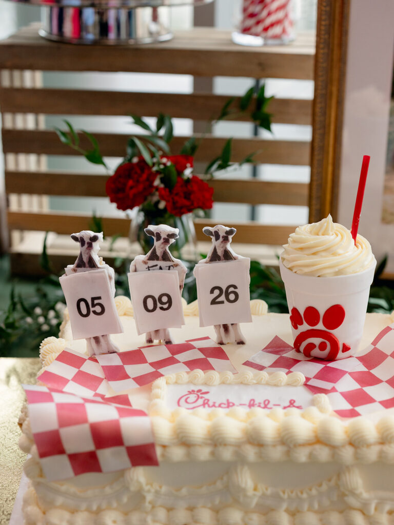 Groom's cake with the wedding date spelled out on tiny signs