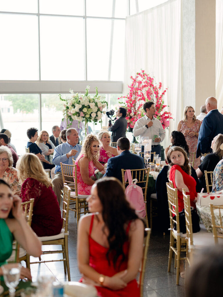 Guests laughing at their tables during the reception