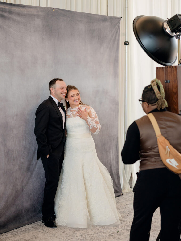 Bride and groom posing at the photo booth