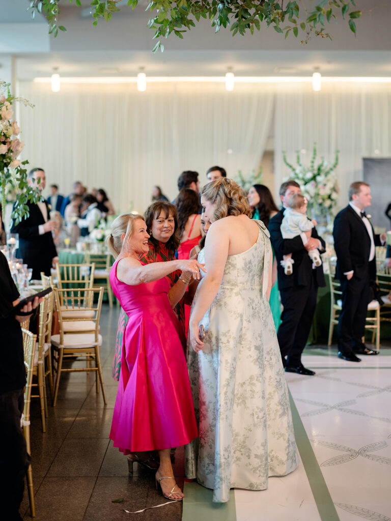 Guests dancing together at the reception