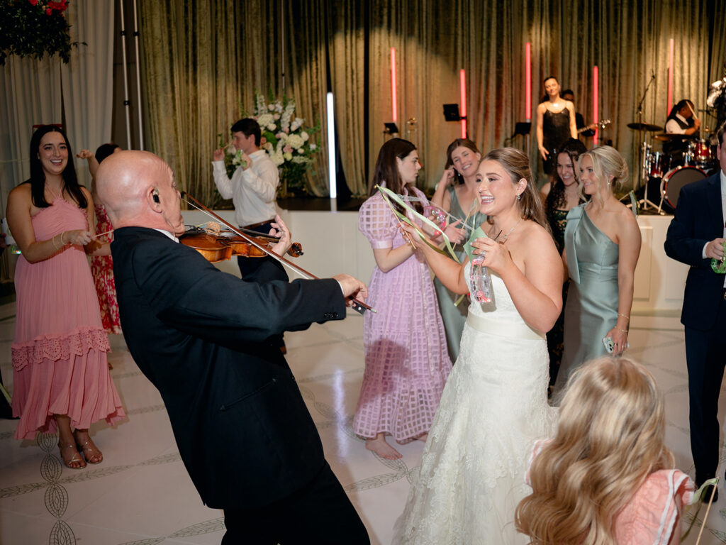 Violinist playing for the bride on the dance floor