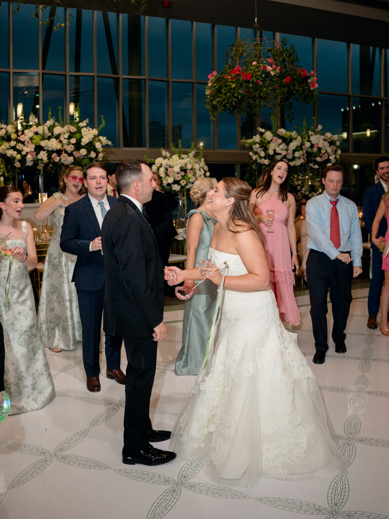 Bride and groom dancing together at the reception