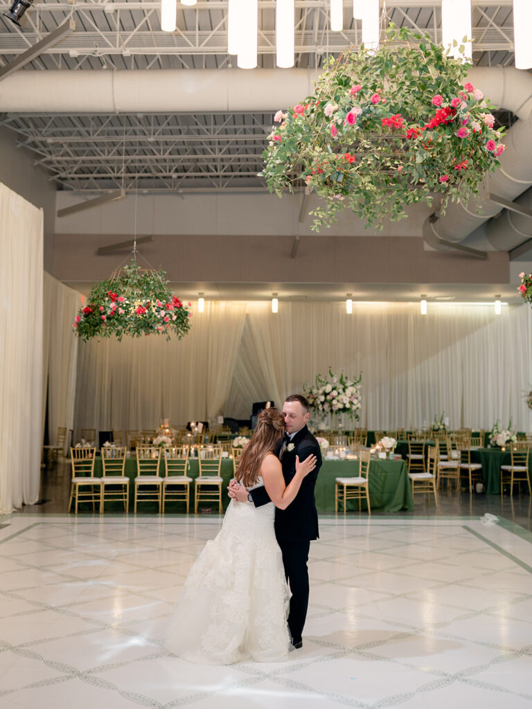 Private last dance under the hanging florals